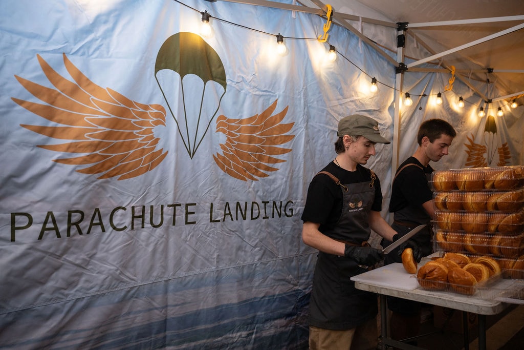 Bun preparation at the Parachute Landing marquee, Anzac Day 2026